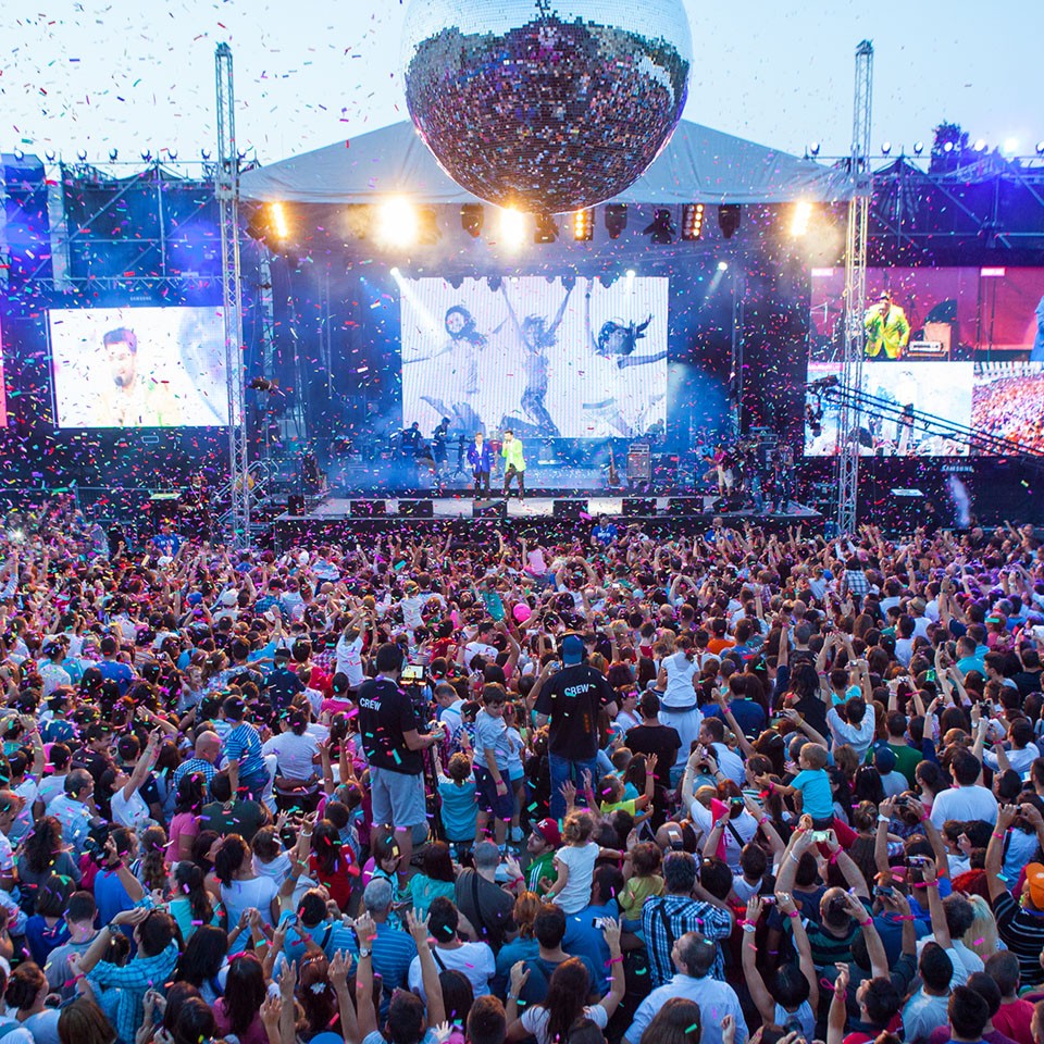 crowded stage of launch event at Romania