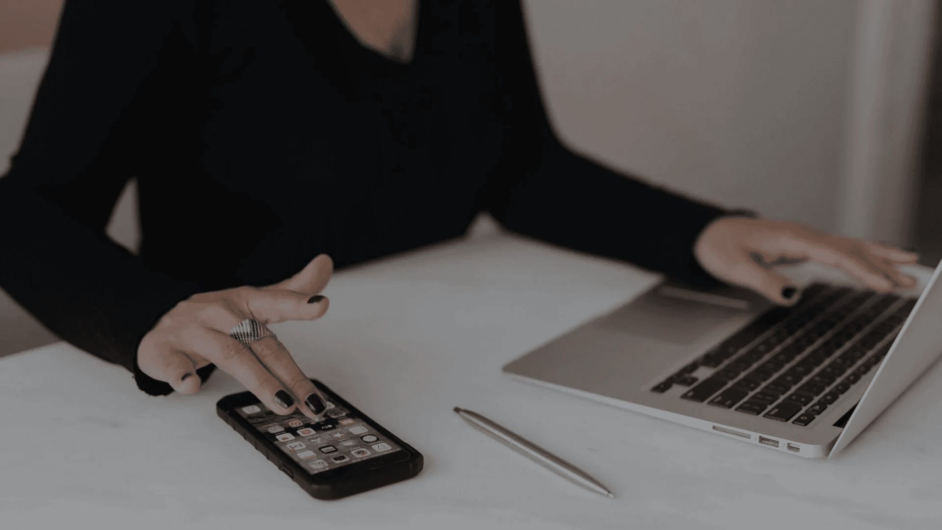 Person using smartphone alongside laptop - Scroll-Stopping Hooks