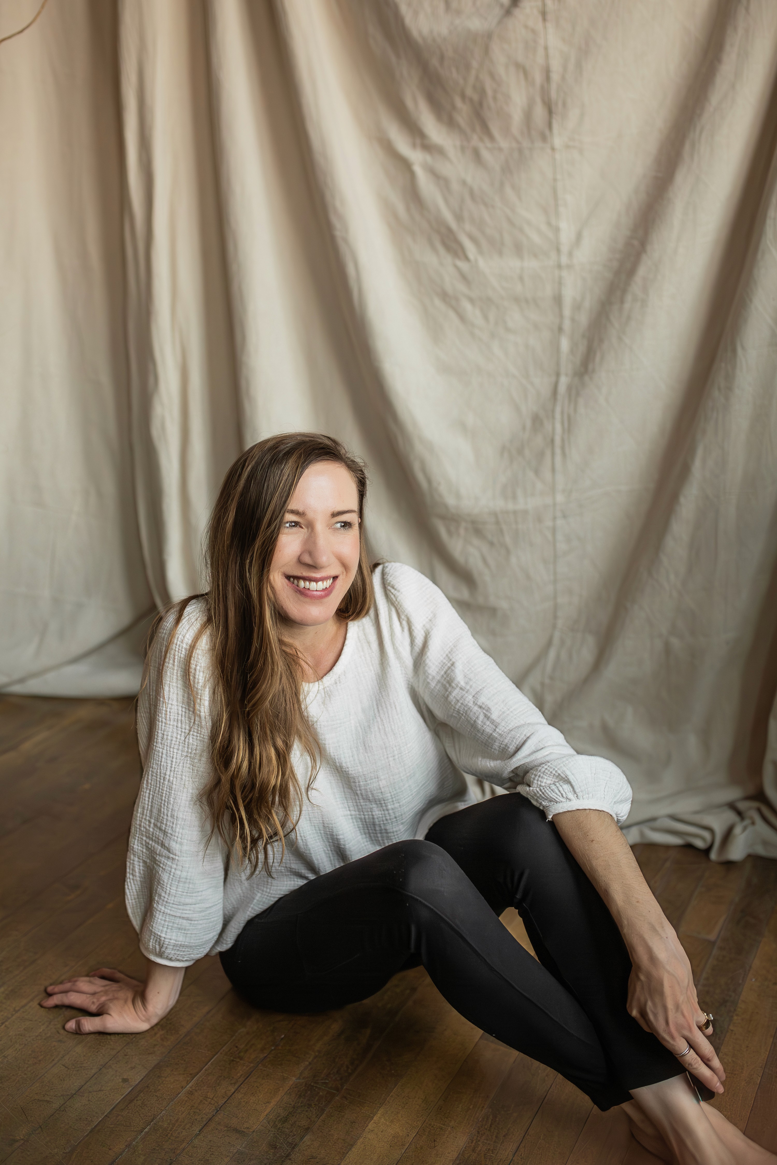 Woman with long wavy blonde hair smiling Staci Carpenter