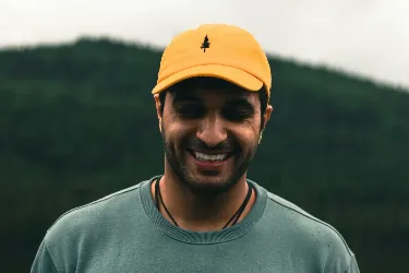 a man wearing a yellow hat