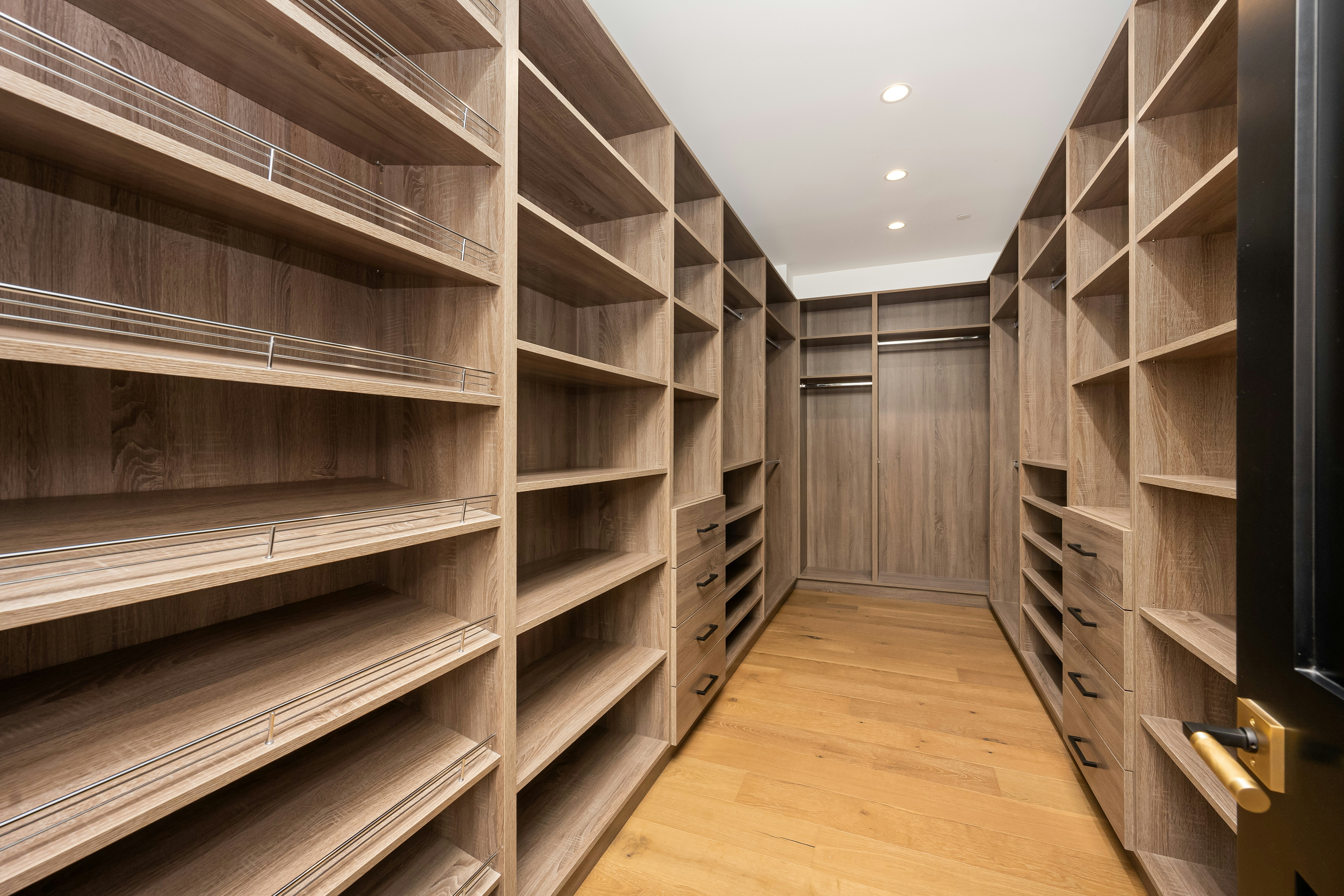 A room filled with lots of wooden shelves