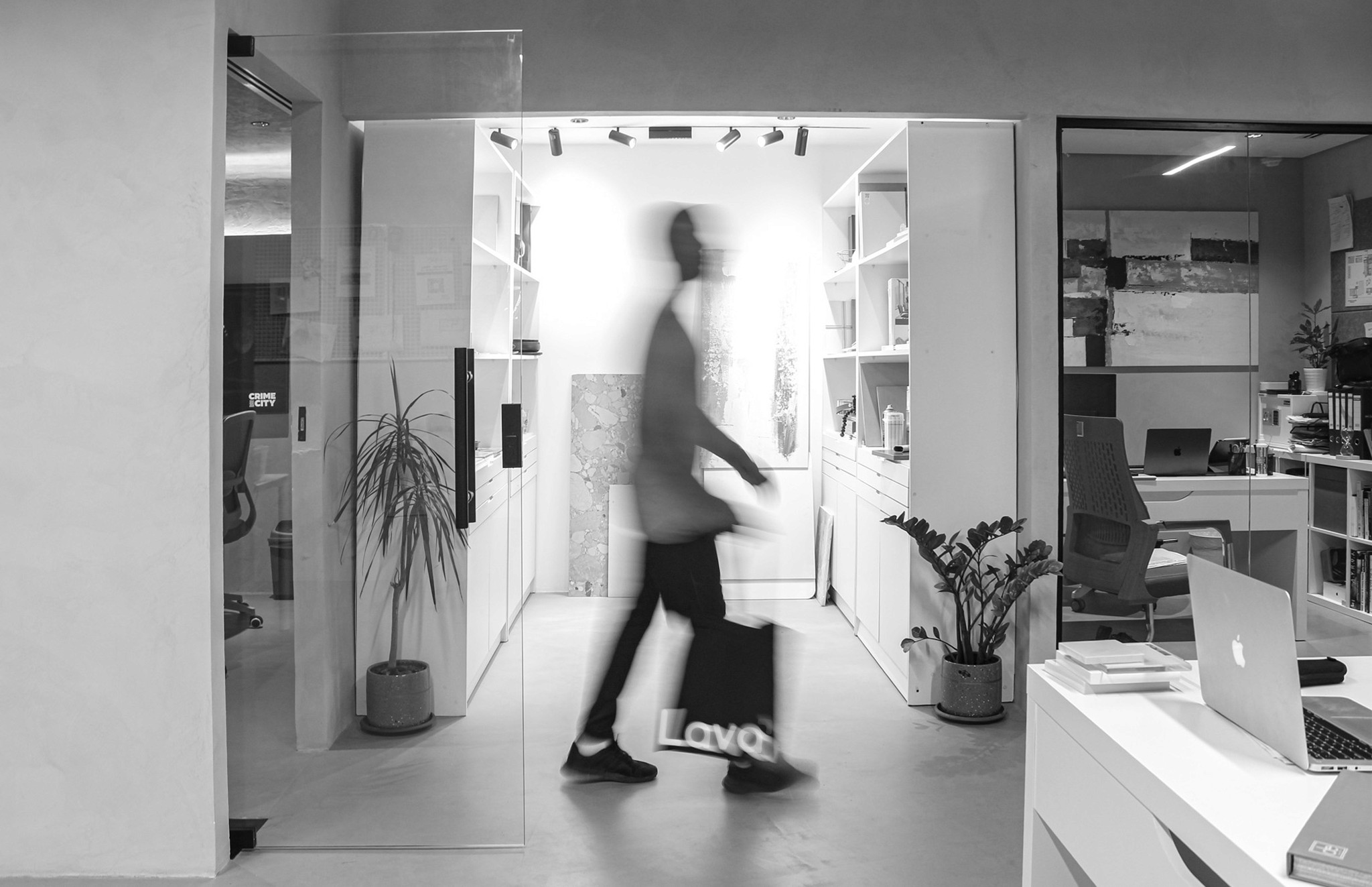Wooden bench in sunlight with geometric shadows on floor.