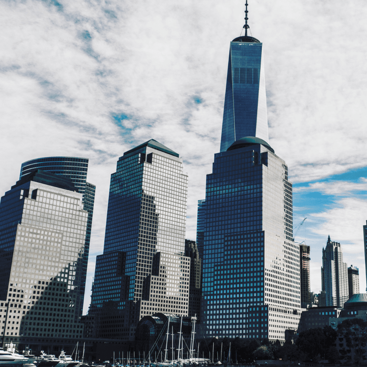 two people looking at a tablet and smiling