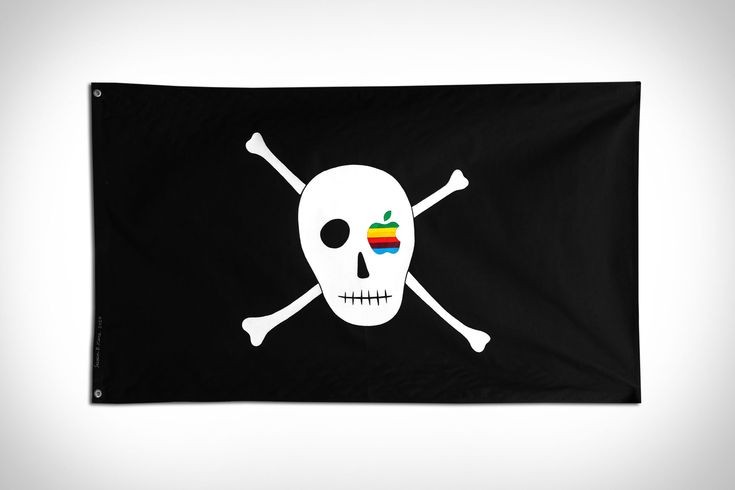 Black pirate flag with a white skull and crossbones featuring a rainbow Apple emblem.
