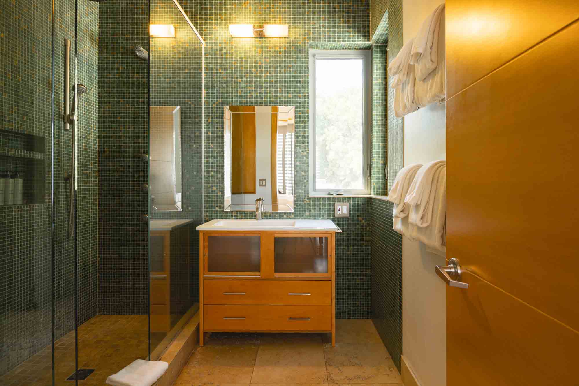 bright and spacious bathroom at Contra House, perfect for group stays in a private Key West retreat