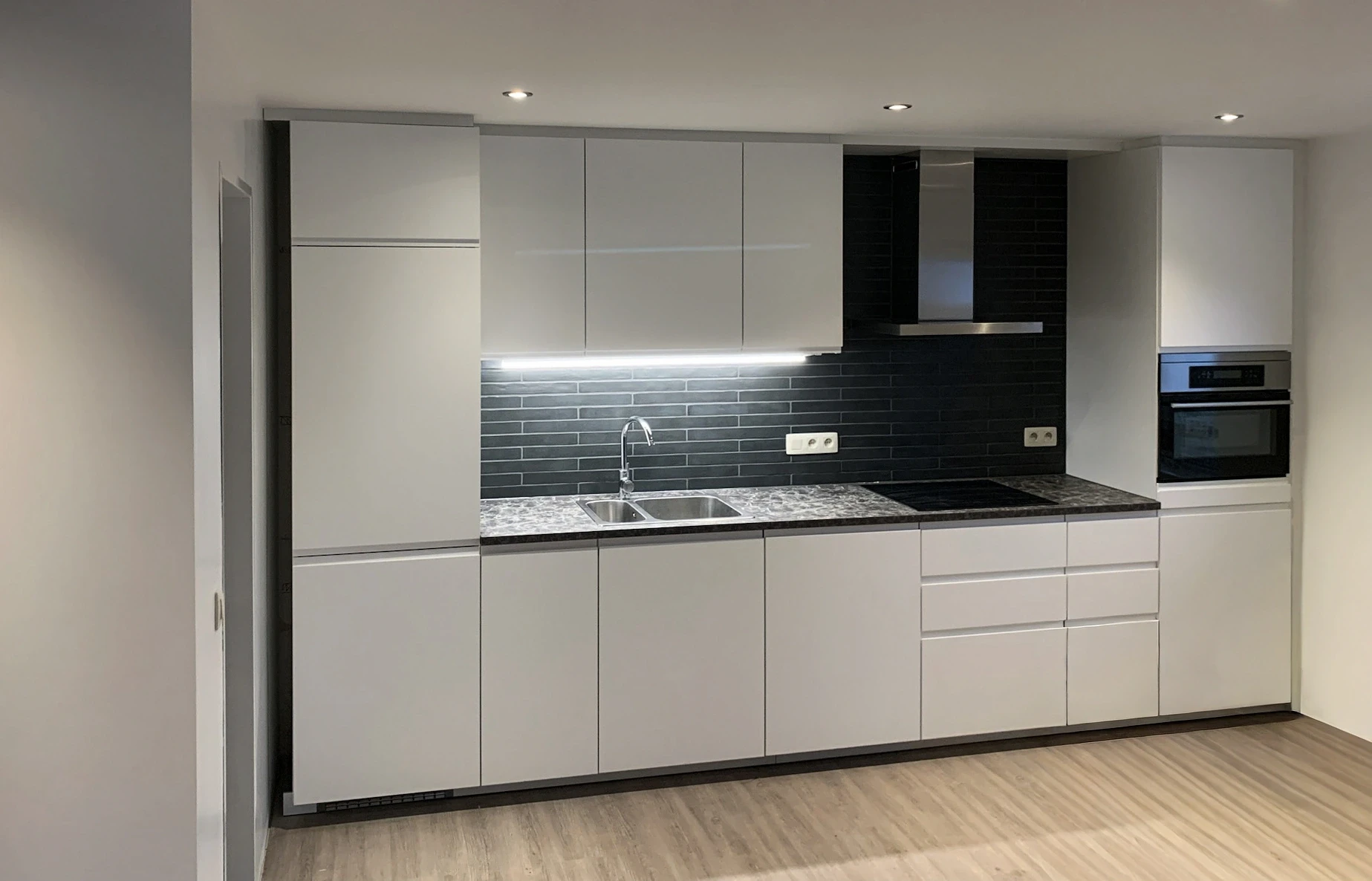A newly installed modern white kitchen.