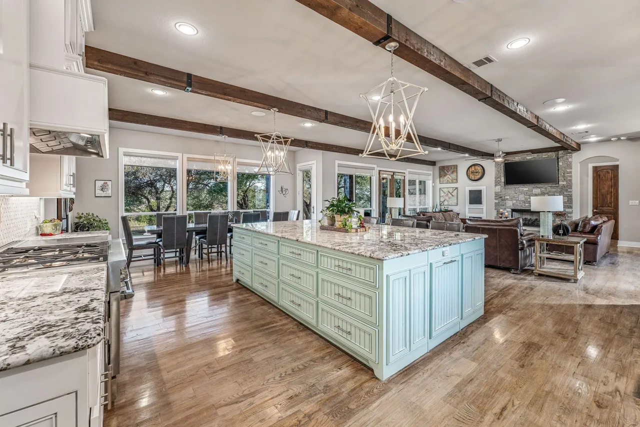 Open-concept kitchen island looking over the living room at 19069 Lakeview Ct