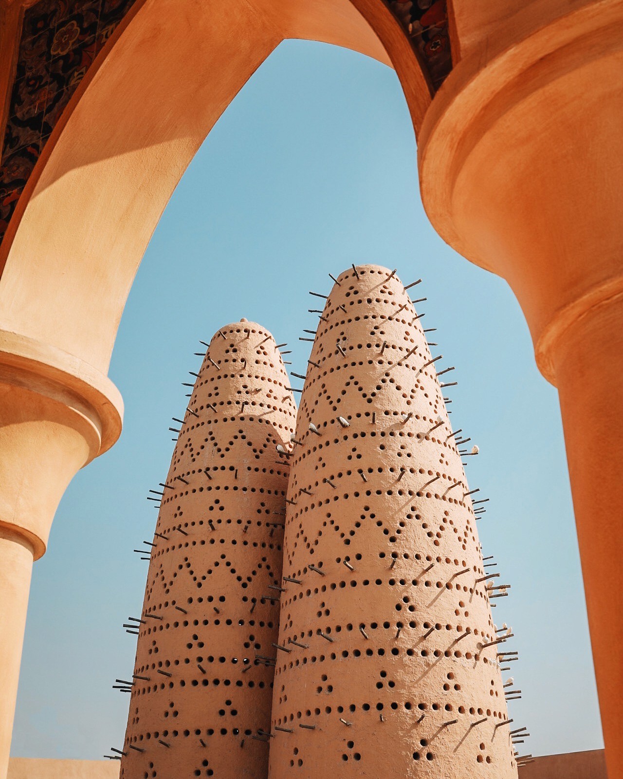 2 building with spikes on it