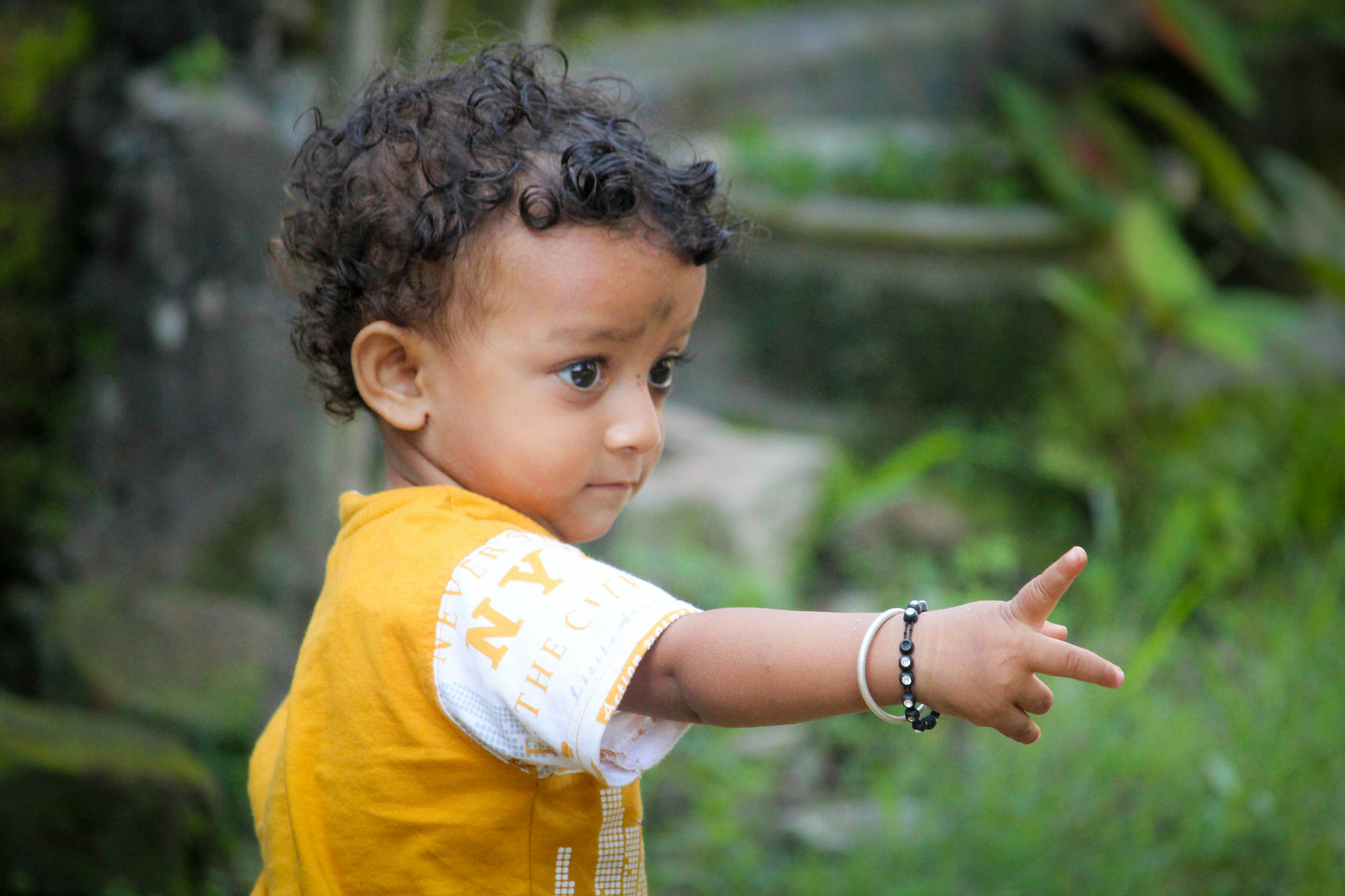 a young girl pointing