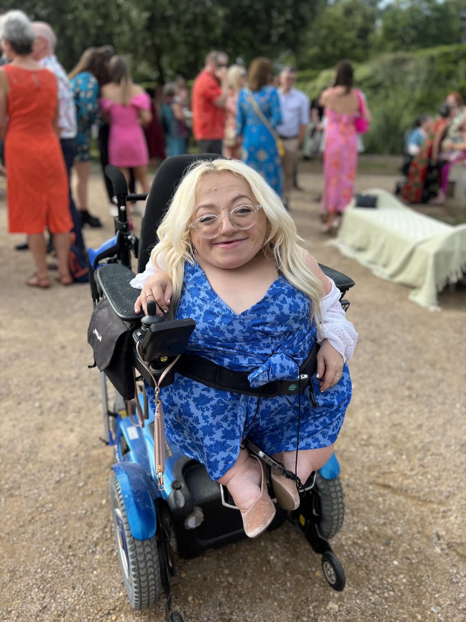 Gem in wheelcahir in blue dress