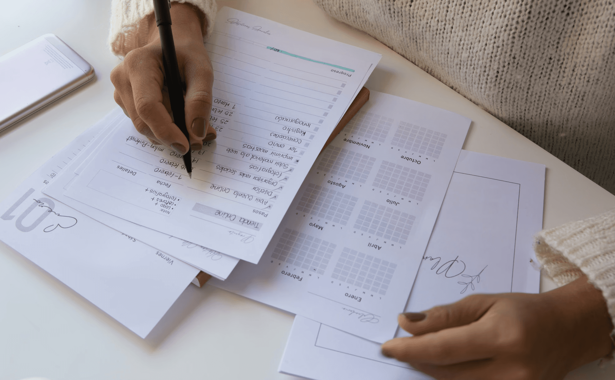 person writing on white paper