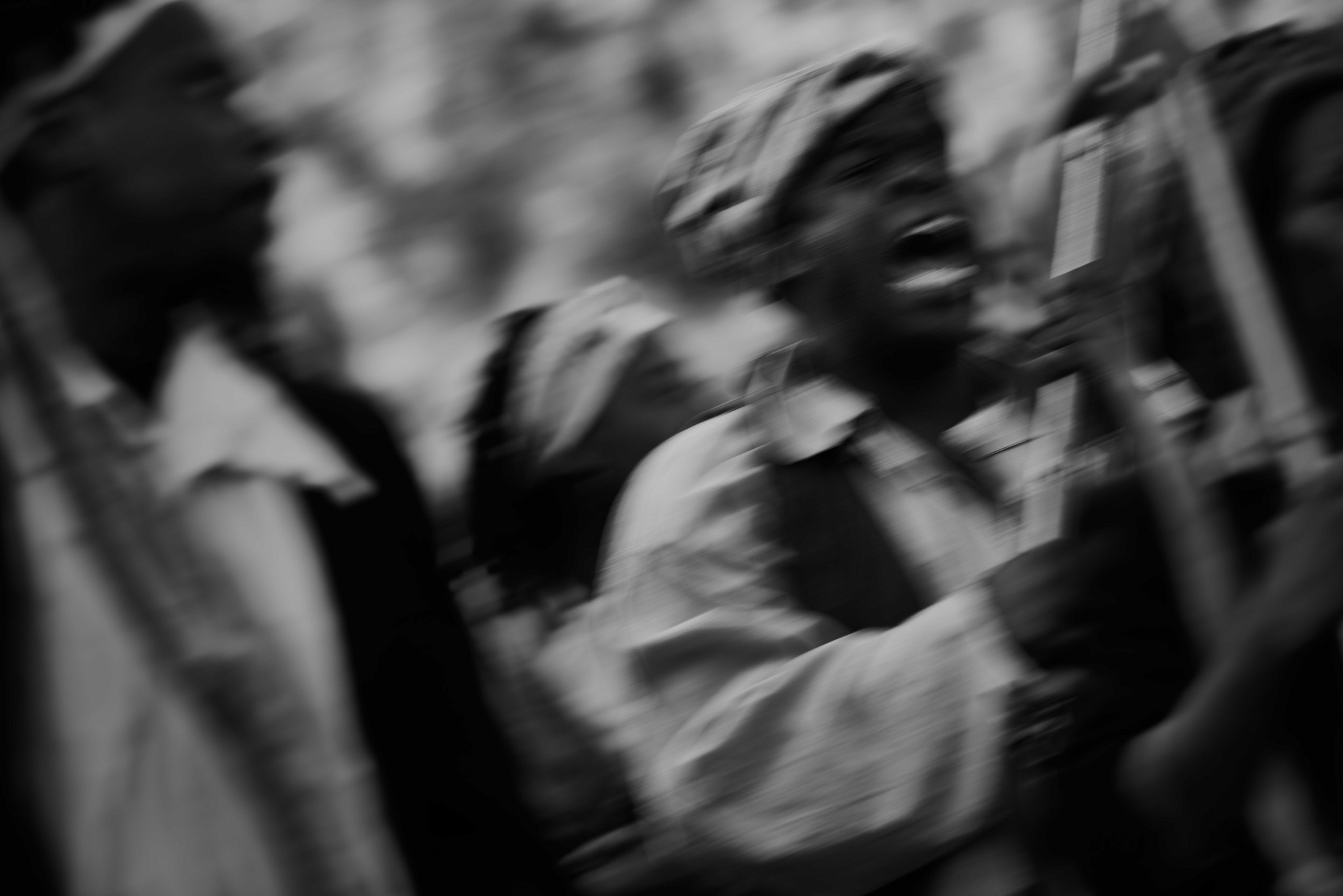 An emotional and expressive photograph depicting an enslaved re-enactor wielding a musket and yelling, photographed during the Dread Scott recreation of the 1811 German coast uprising. 