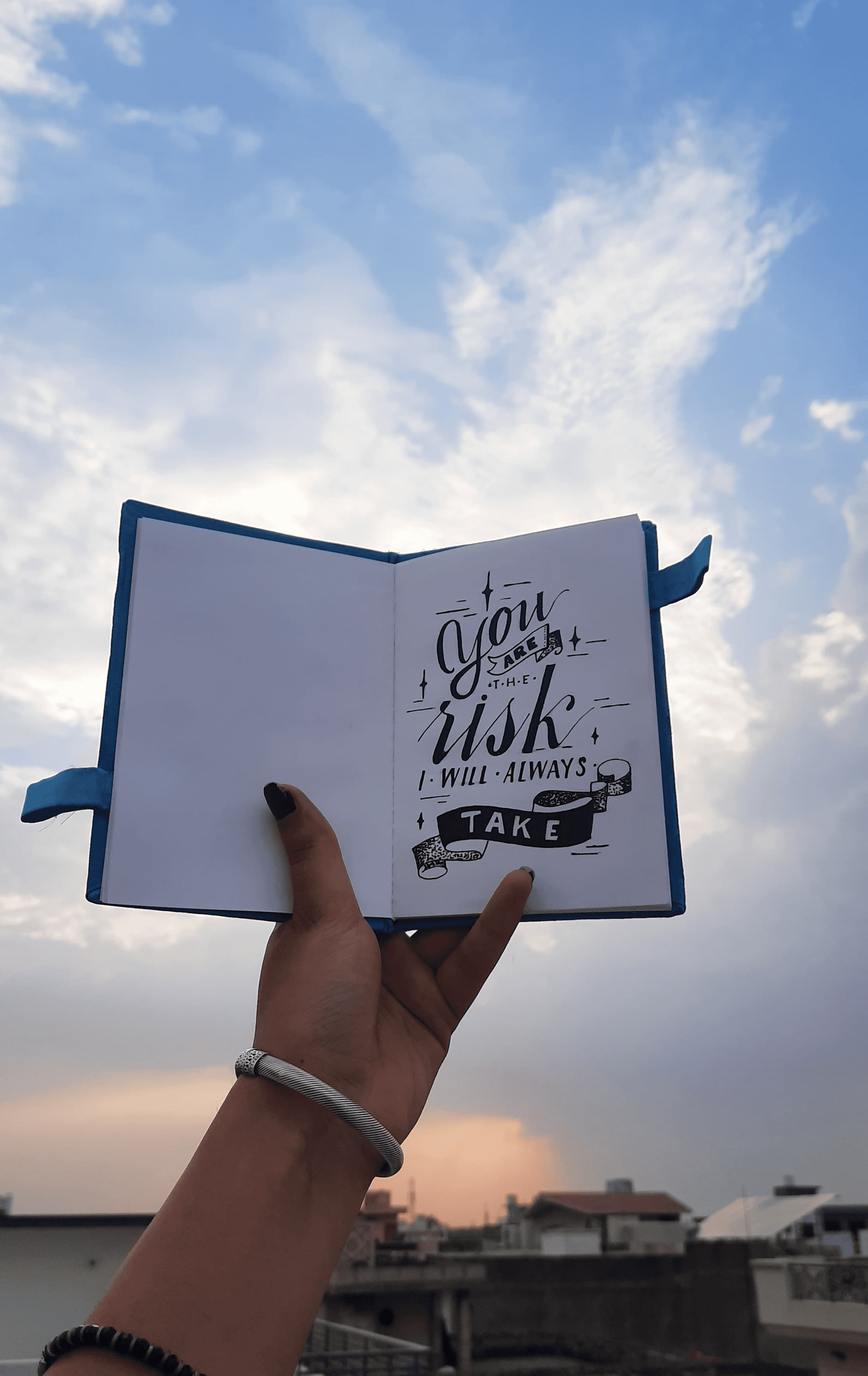 a group of people walking on a sidewalk