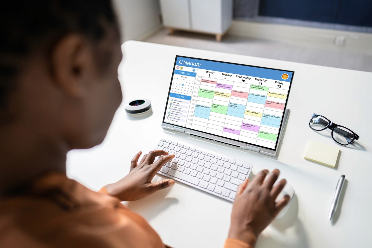 A person looking at a busy work calendar while planning their day and hoping to avoid the 3pm energy slump