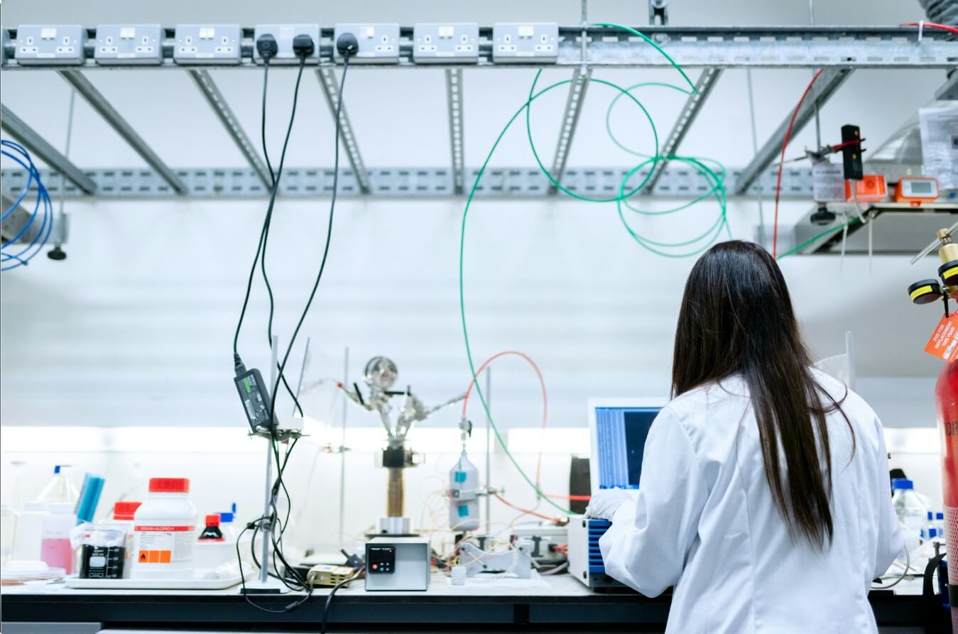 woman in white long sleeve shirt sitting on chair
