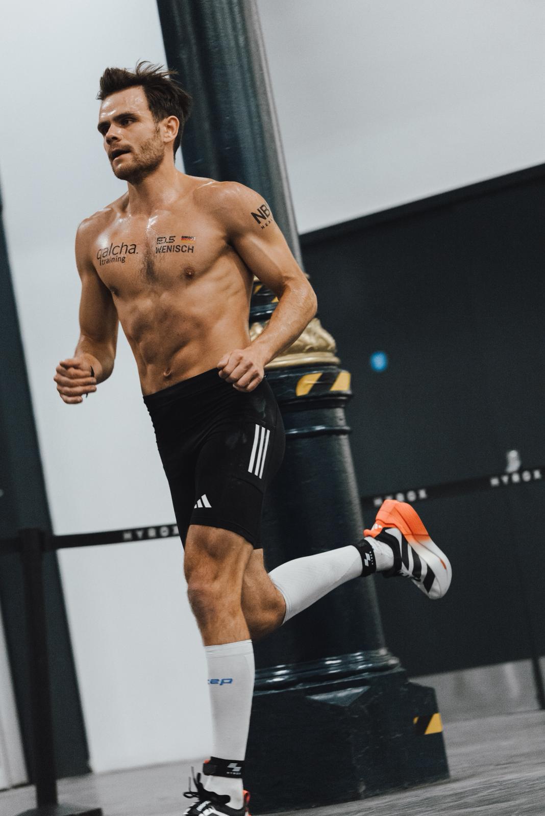 grayscale photo of bike on wall