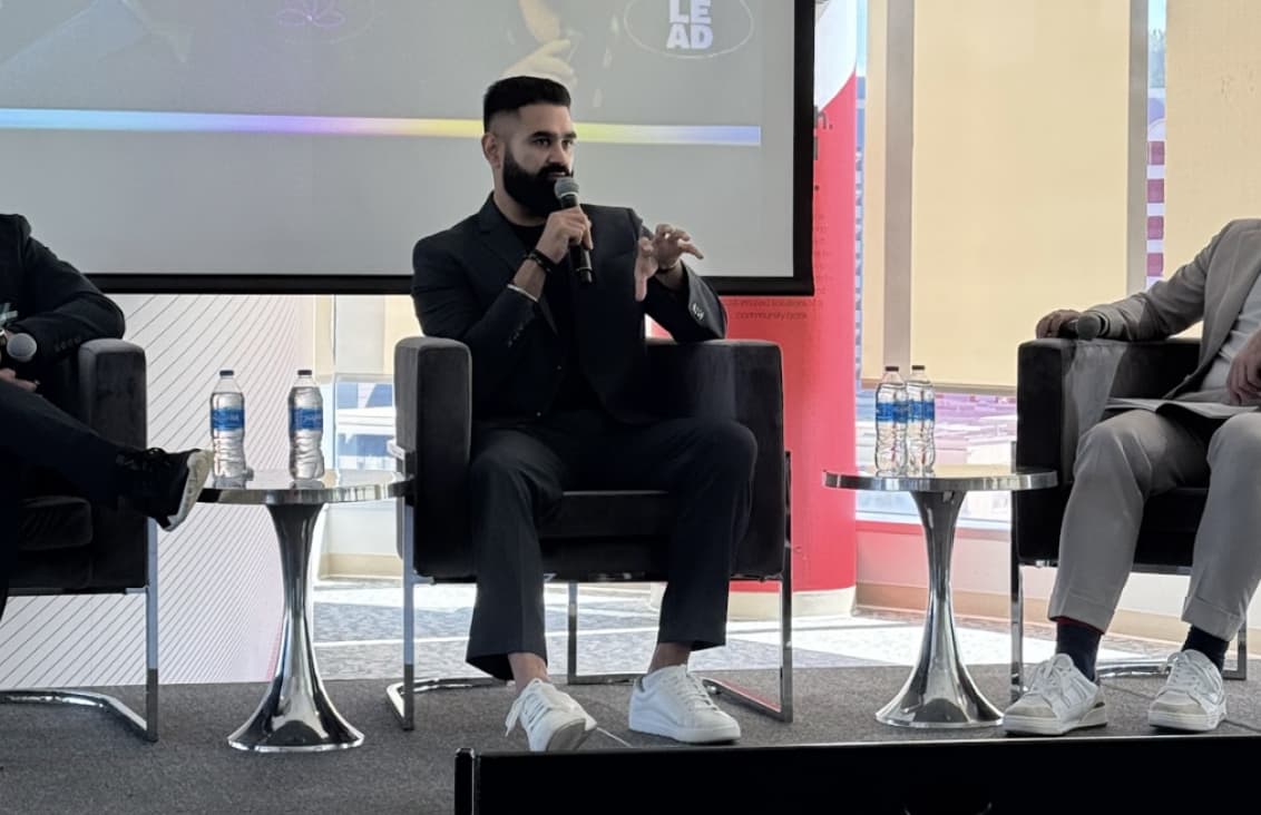 KJ Dhaliwal speaking on stage