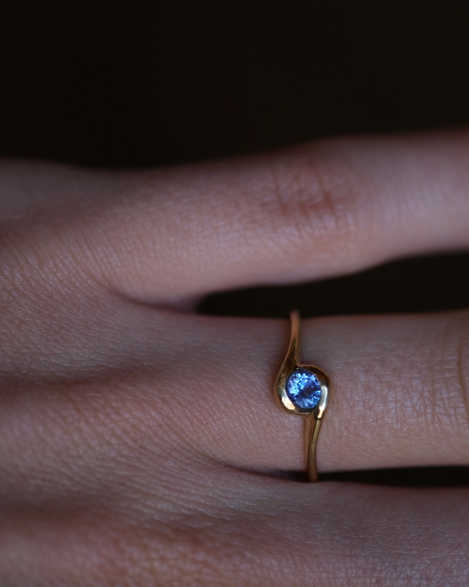The tanzanite ring on a finger