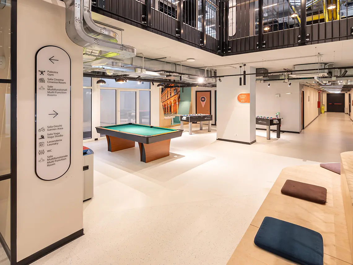 Games room with table football and a Bologna portico mural in student accommodation