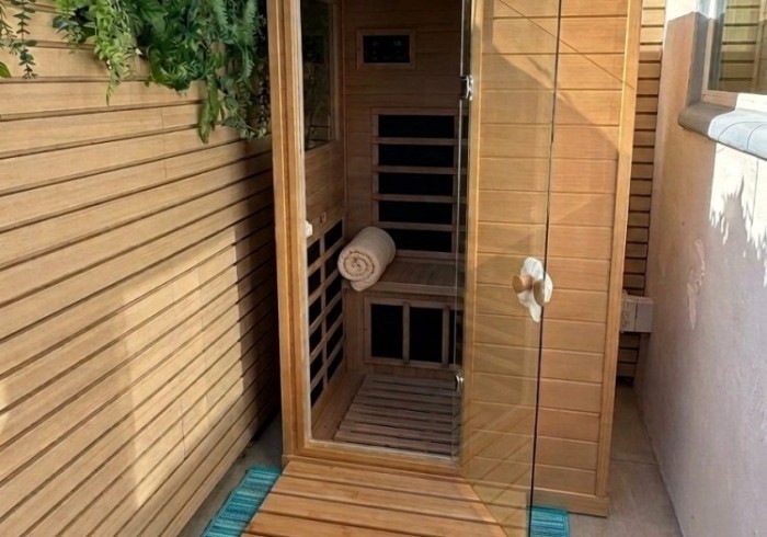 a black and white living room with a large tv