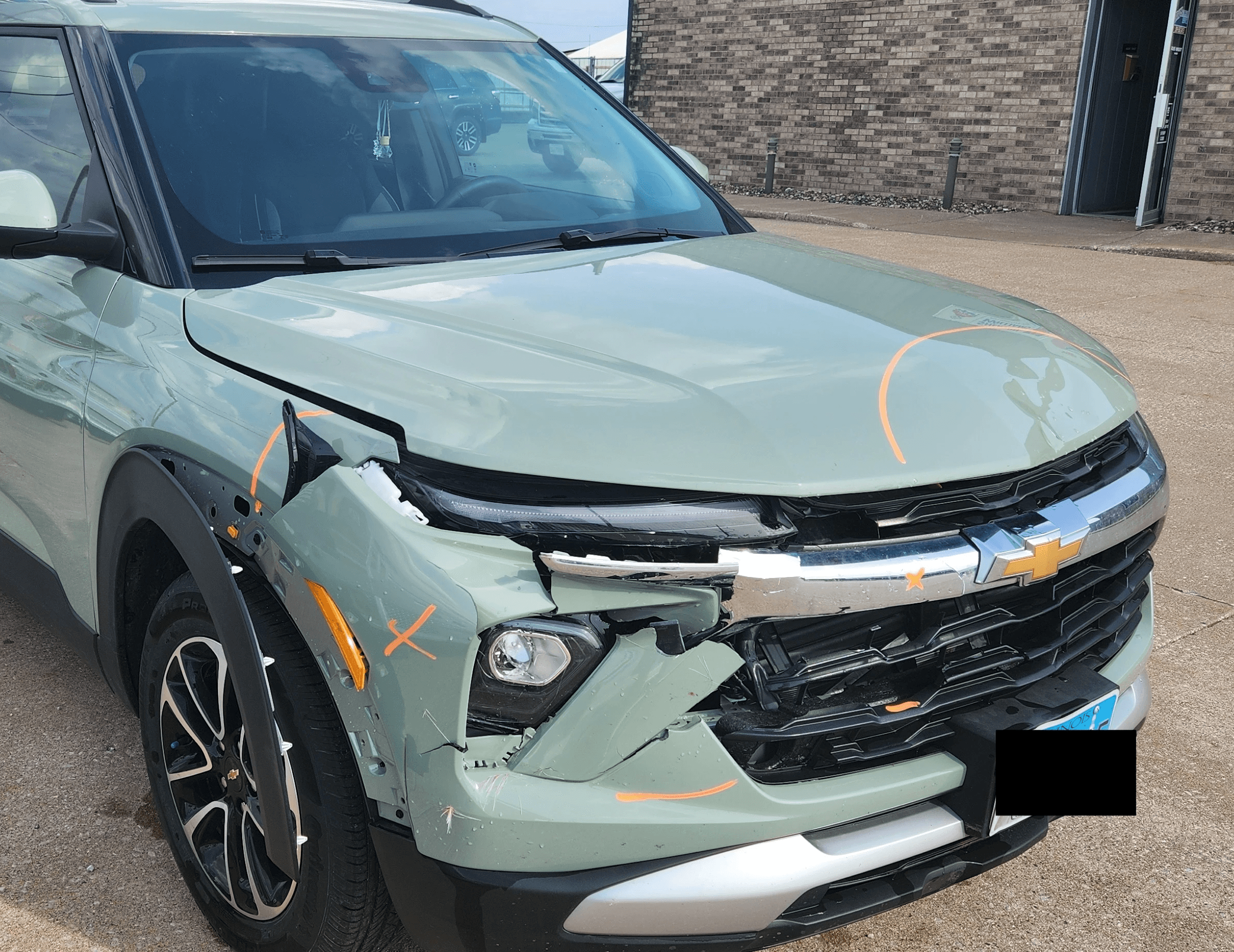 Damaged Chevy SUV before repair