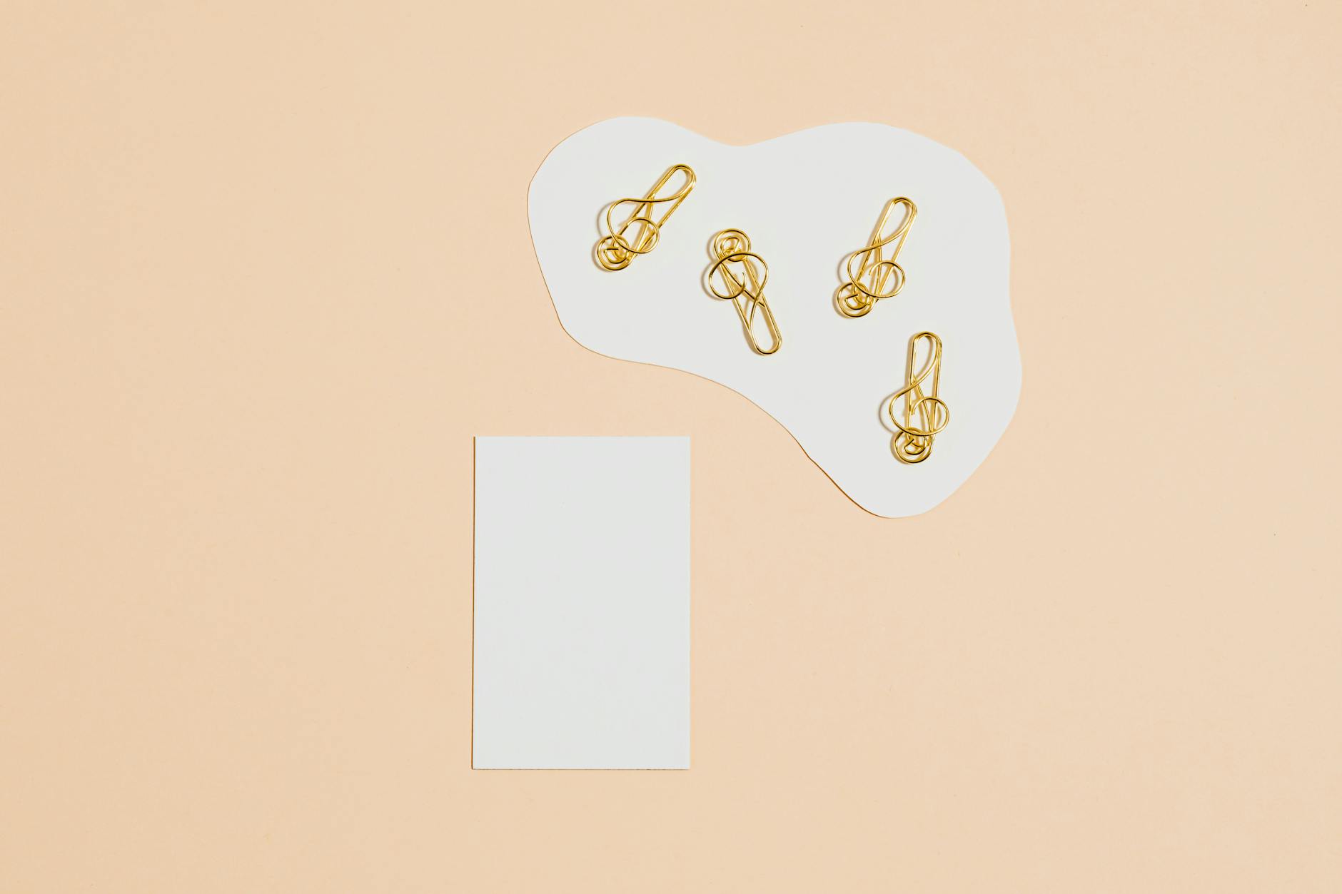 A teacher pointing to a colorful poster displaying basic geometric shapes preschool students need to learn.