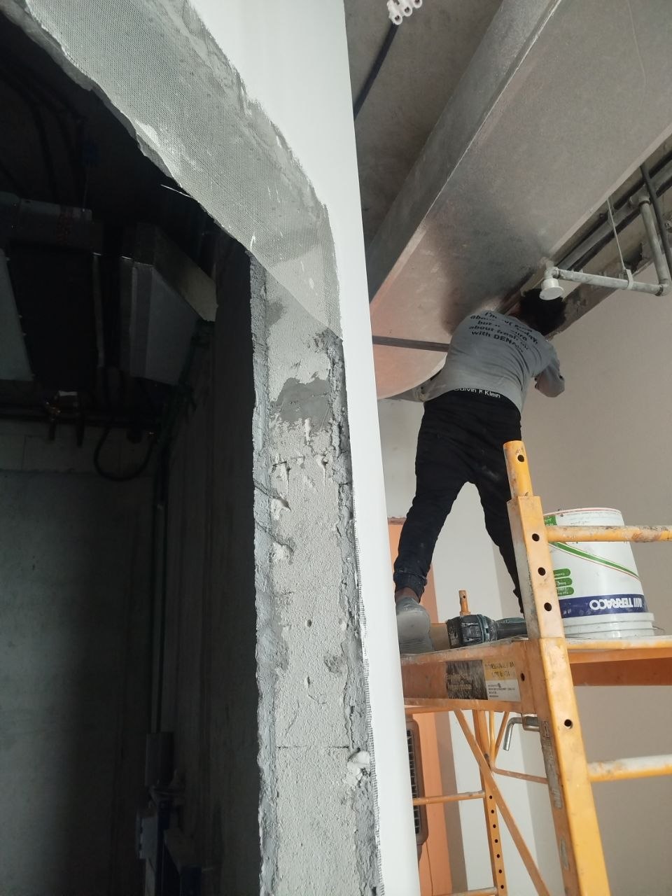 DENAIR technician working on an apartment HVAC installation