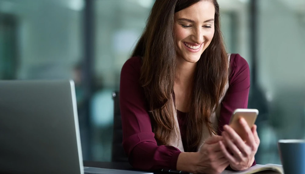 business smartphone woman with laptop workplace