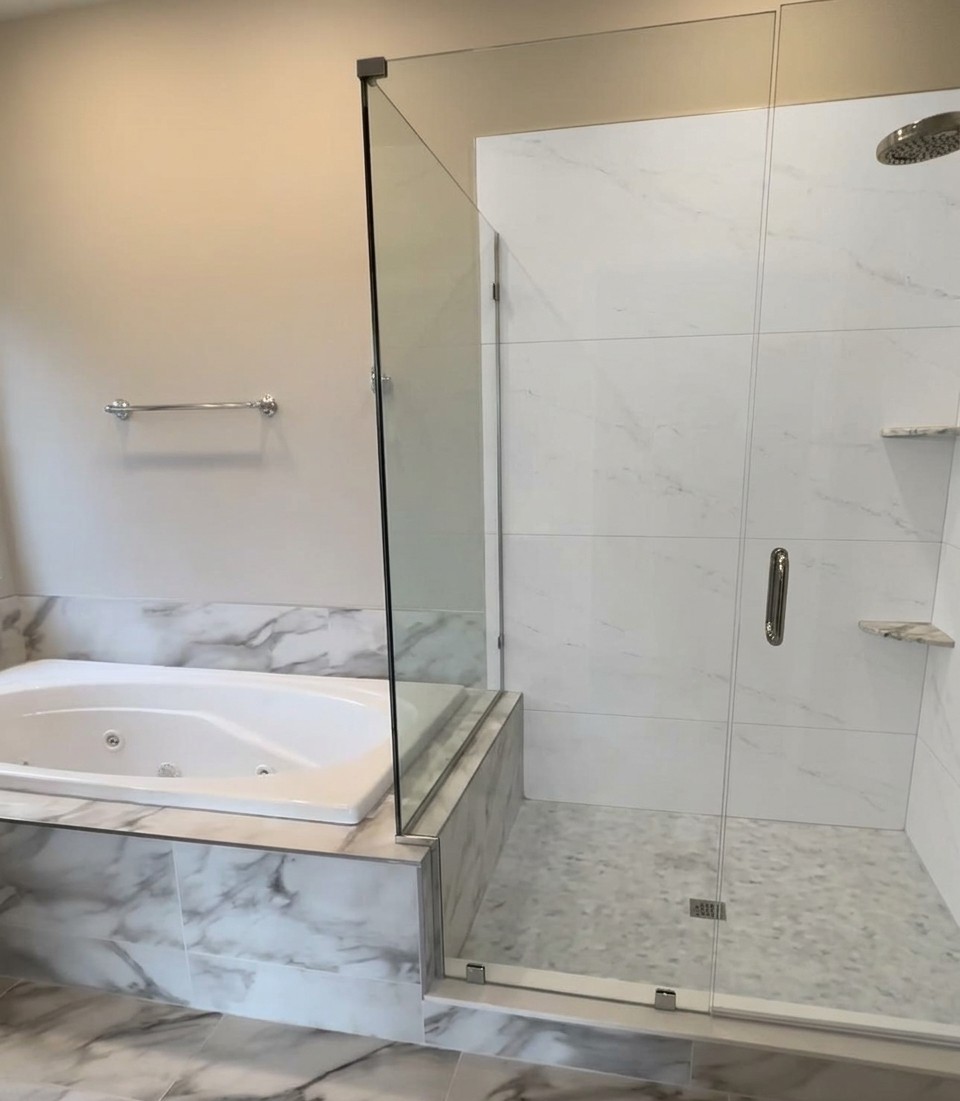 Same bathroom with white large-format porcelain tile replacing shower wall tile, clean and minimal