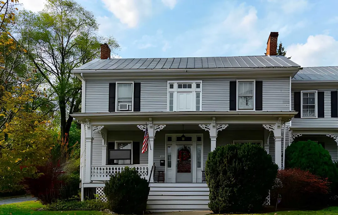 A historic two-story residential home in Centreville, VA, maintained by a licensed plumber providing expert repairs.