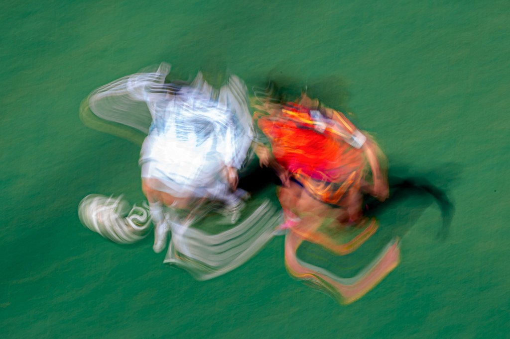 Motion-blur action of Spain and Argentina players colliding during the 2026 World Cup final