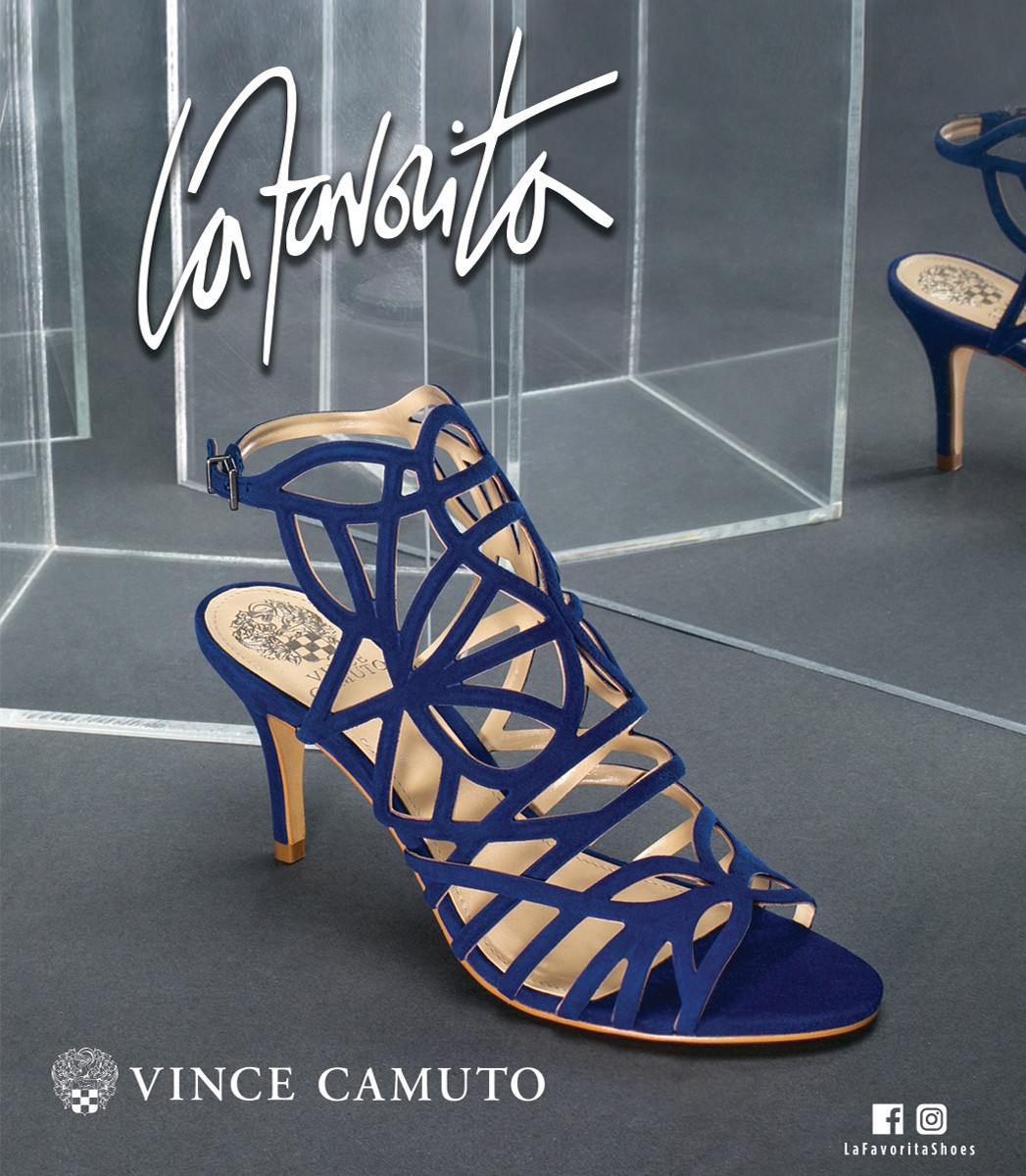 La Favorita ad featuring a blue Vince Camuto heel against a mirrored backdrop, emphasizing its intricate cut-out design.