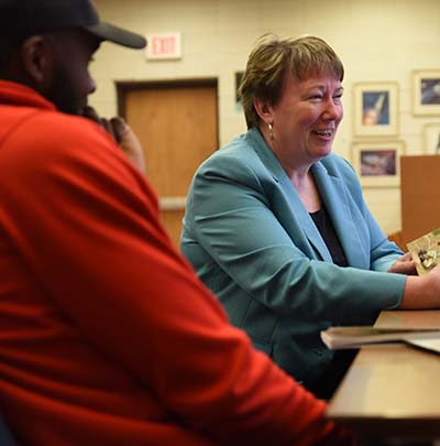 Gina Kuker works with a student