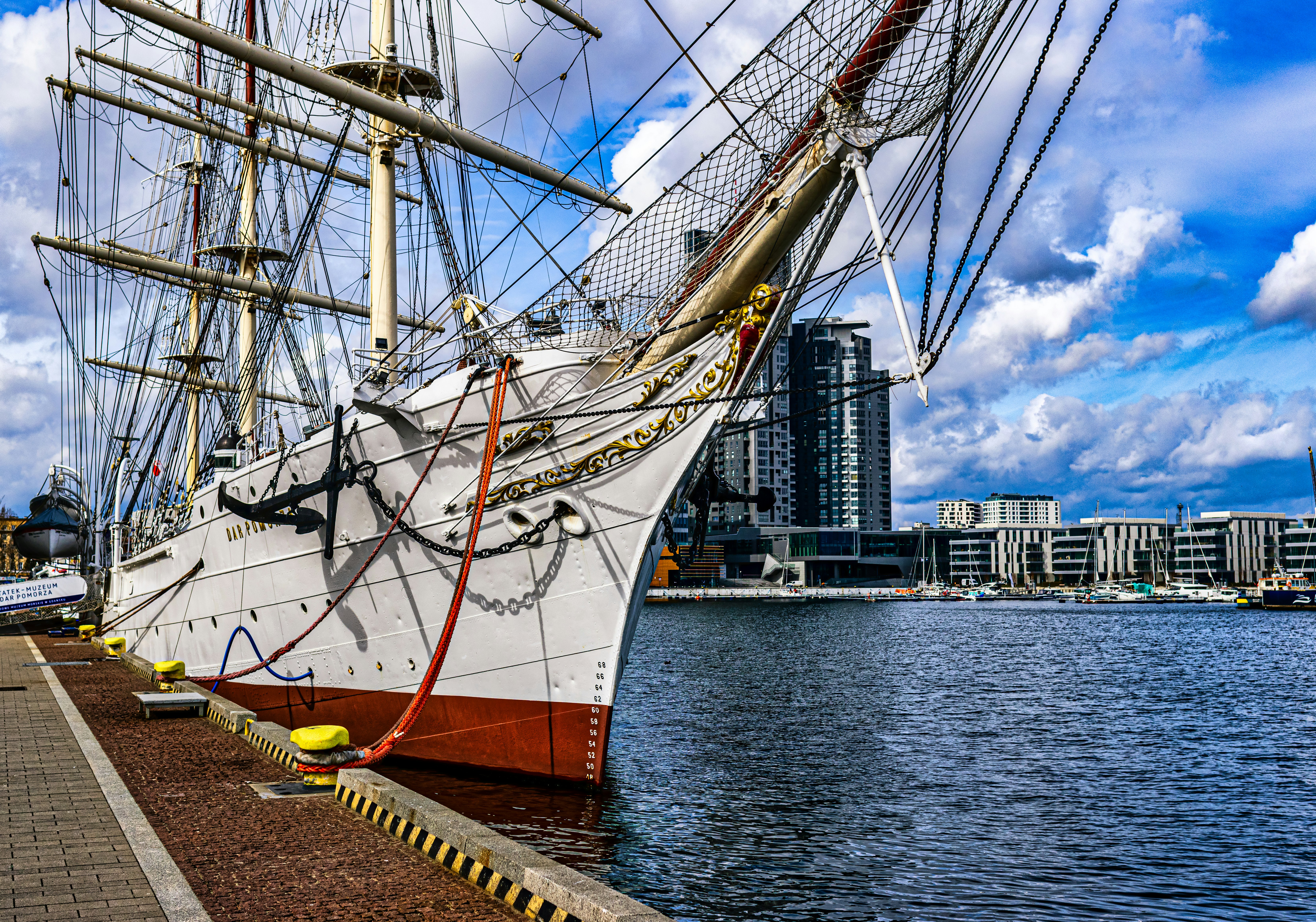 a large white ship docked in a harbor