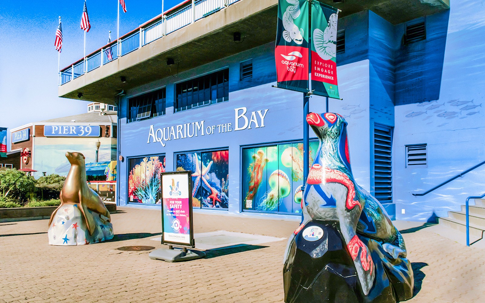 Aquarium of the Bay entrance with sea life murals and sculptures, San Francisco, California.