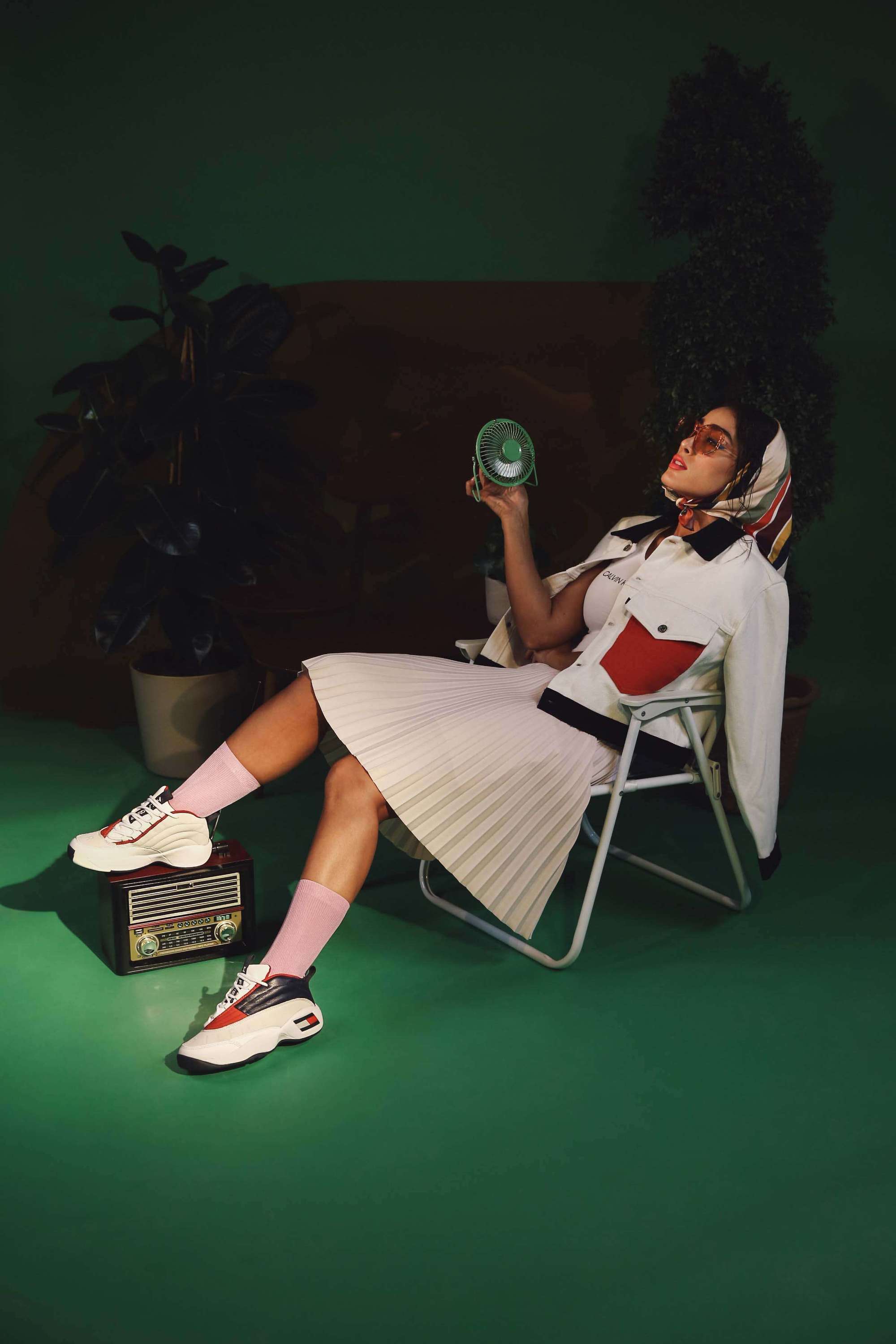 Woman on chair showing her shoes: 6thStreet Shoe Collection Photoshoot | Relity Group