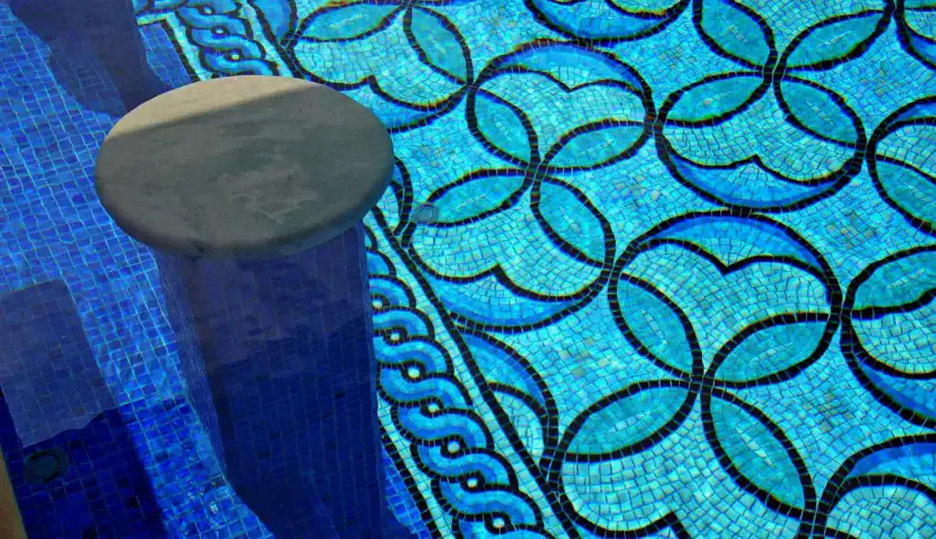 Mosaic mosaic glass pool with intricate geometric patterns on Lake Austin.
