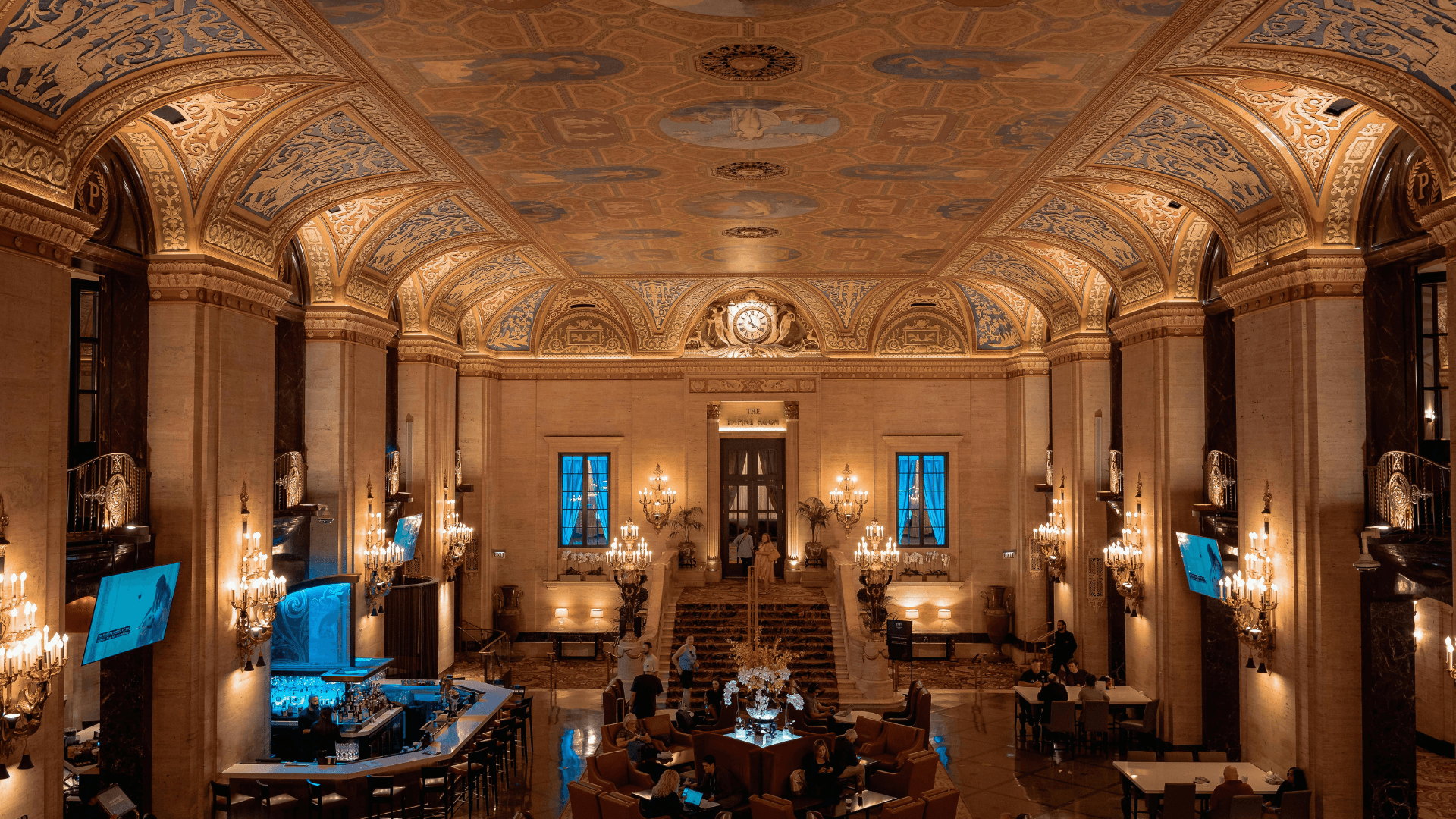 Elegant hotel ballroom under construction lighting with golden tones and detailed ceiling design | Lunasole Hospitality