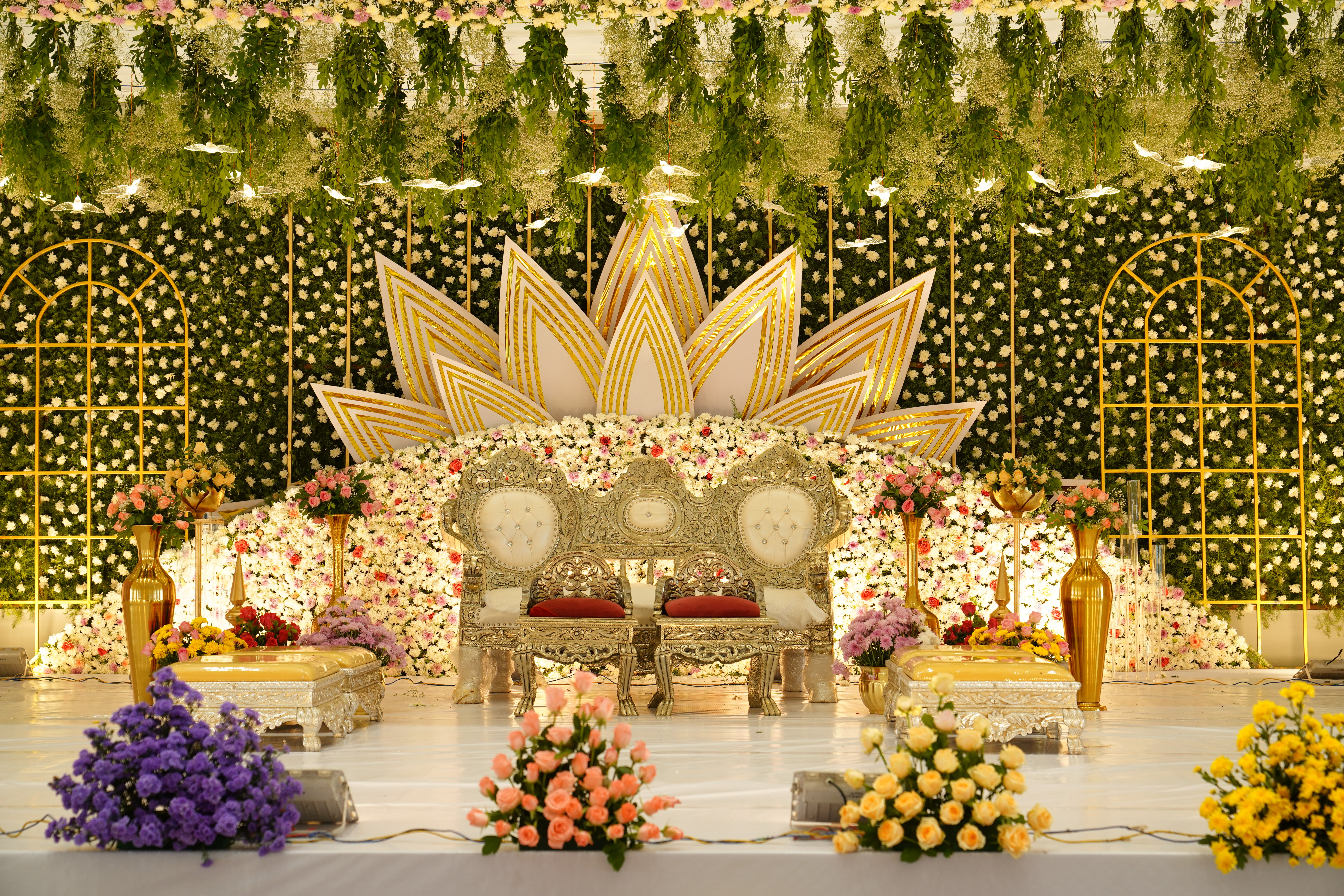 Wedding stage and mandap decor with floral and lighting arrangements, styled and captured by Wow Makers in Hyderabad, India
