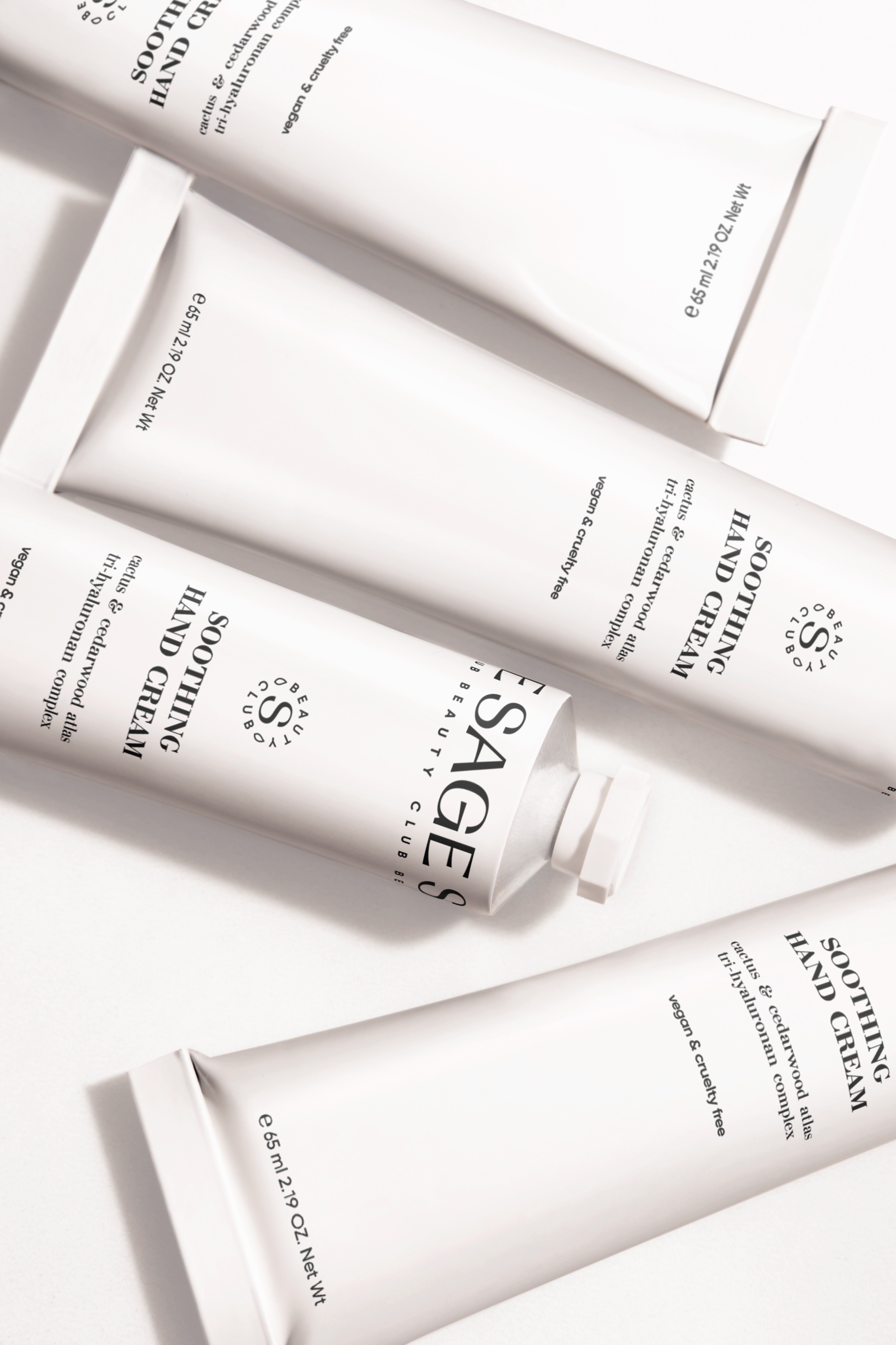 Streetside billboard with flyposters of the Batch.Works brand and illustrations