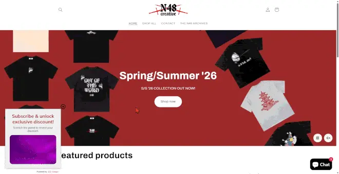  N48 Creative e-commerce homepage with a bottom-left floating gamified popup featuring an interactive purple metallic scratch-off panel