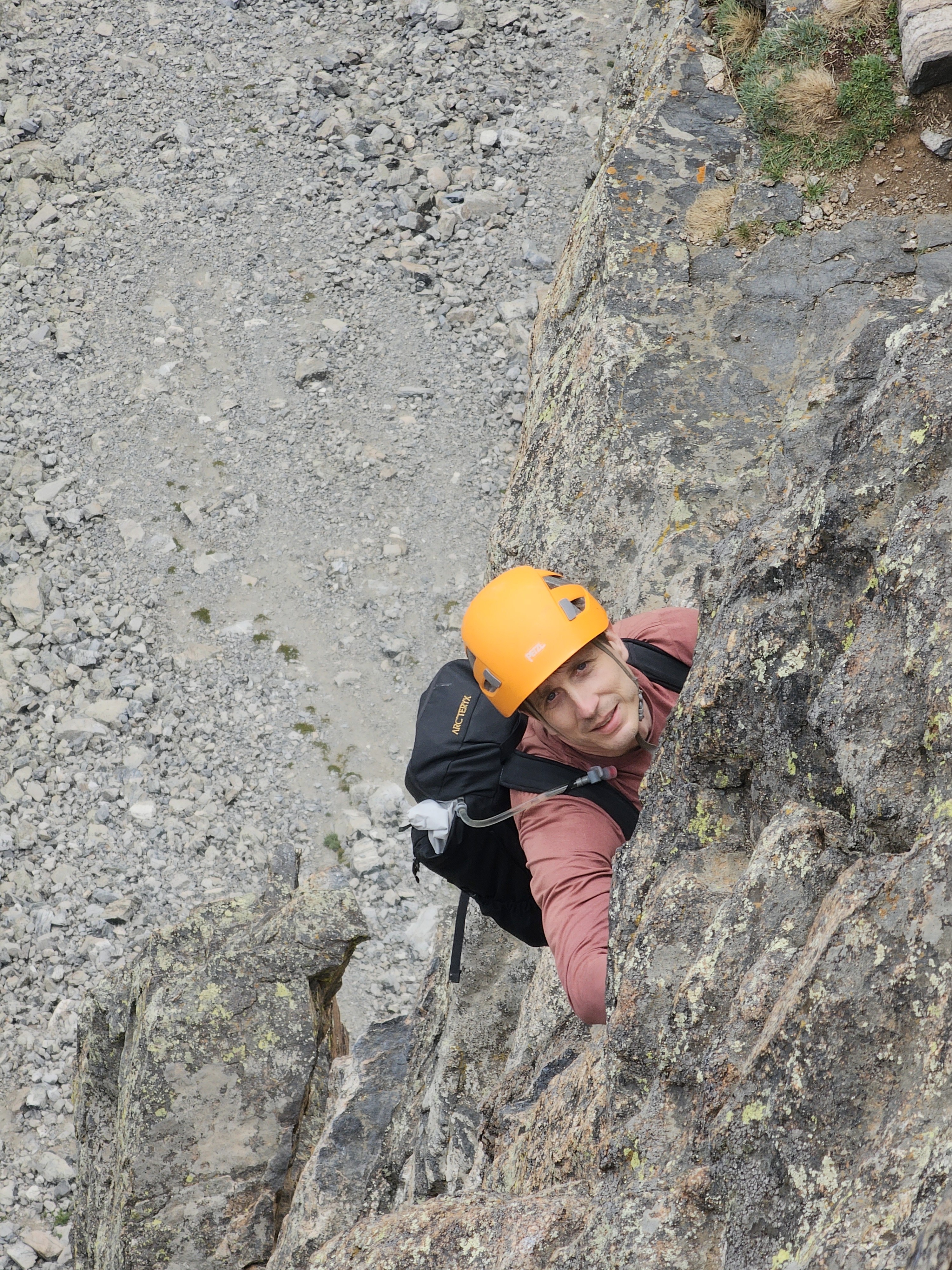 Climber smiles near the last pitch of Petit Grepon