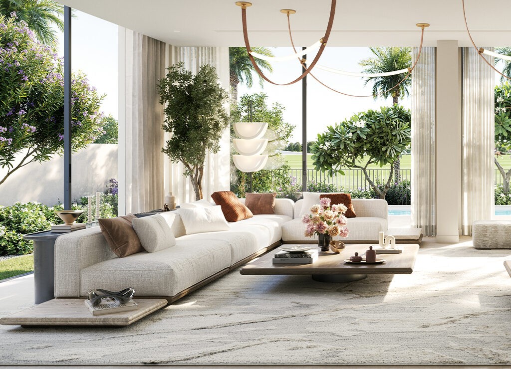 Bright living room with a large white couch and expansive window, part of the Equiterra at Grand Polo design.