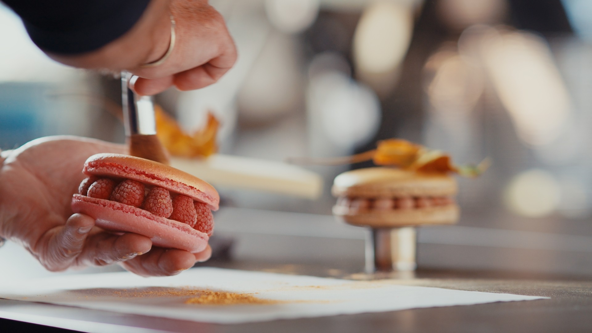 A man wearing a virtual reality headset, immersed in a digital experience, with a focused expression on her face.