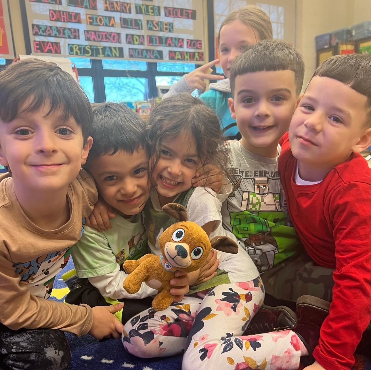 A group of students huggng