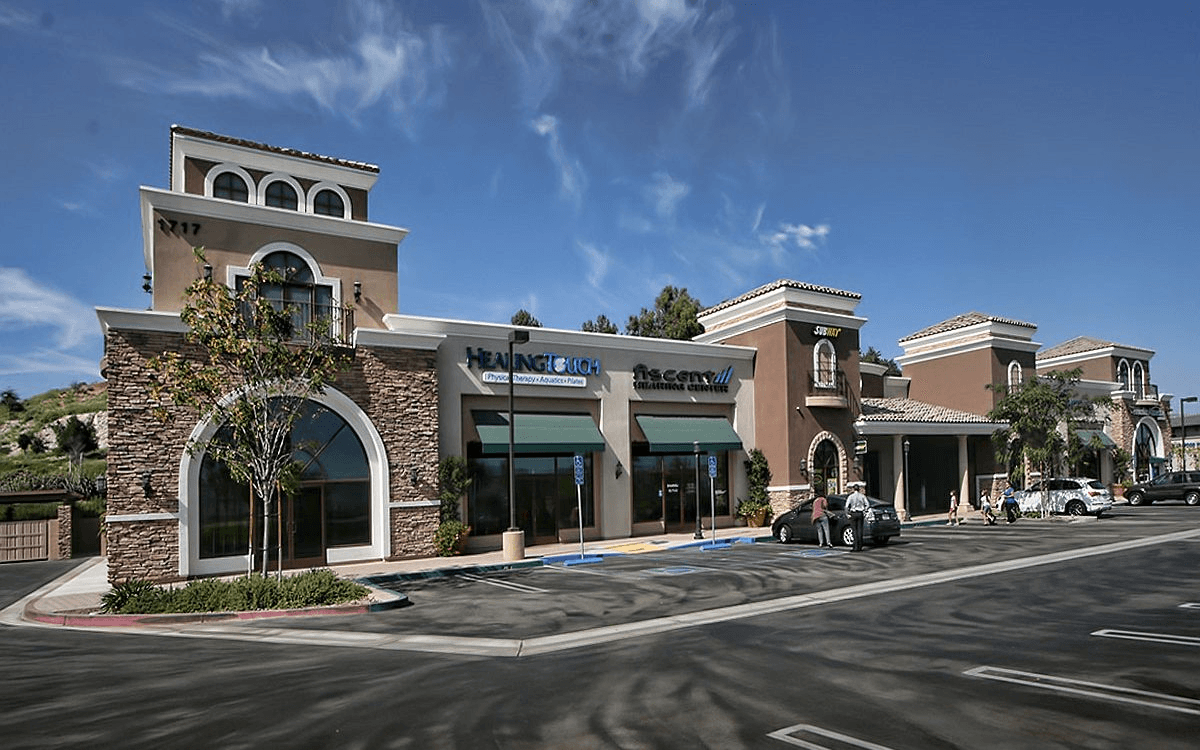 Exterior view of the mall with the parking lot, showcasing the unique design features.