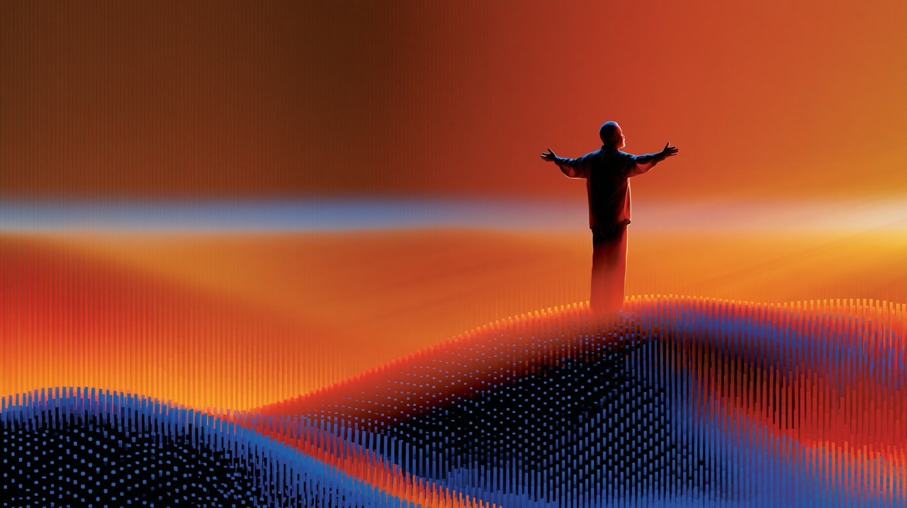 Solitary human silhouette standing on a mountain peak arms open wide, warm amber to gold sky, god rays