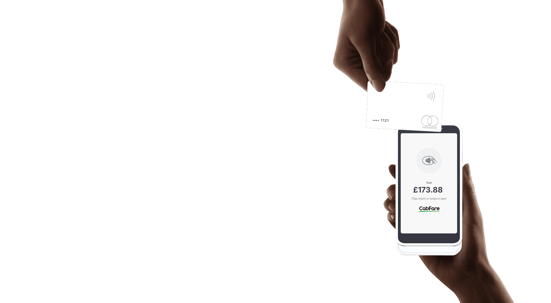 A man driving a car. He is wearing a grey sweater and is looking at the camera with a slight smile.