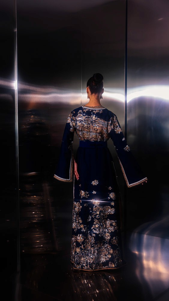 Black Moroccan caftan with gold hand embroidery, elegant handcrafted couture piece prepared in Bahrain