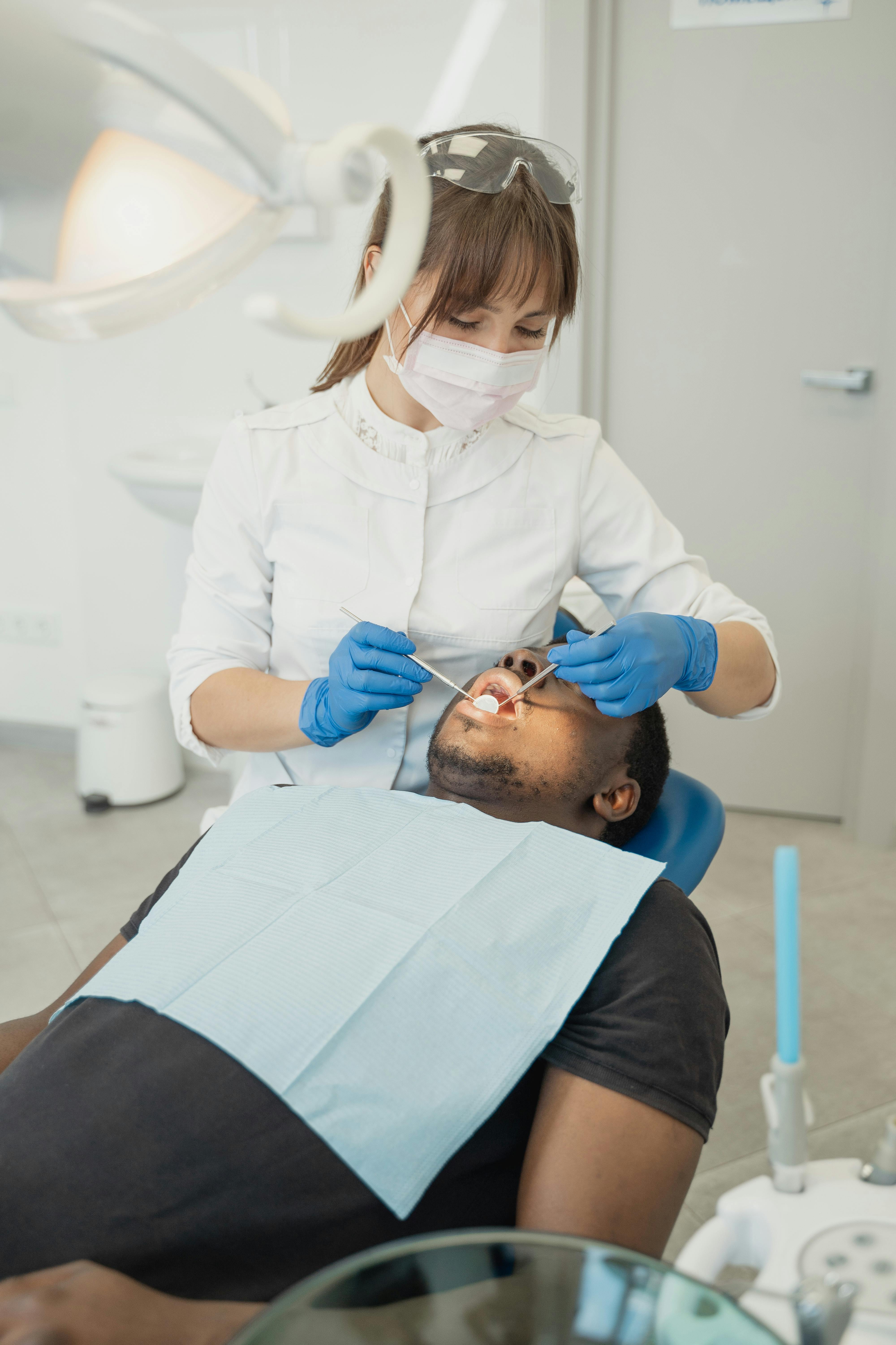 Dental hygienist performing a professional routine cleaning at a general dentist in National City.